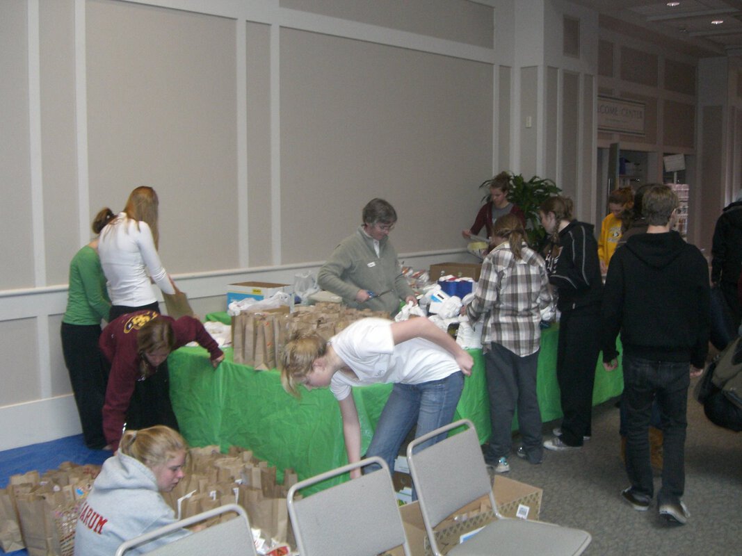 Making give-away bags.